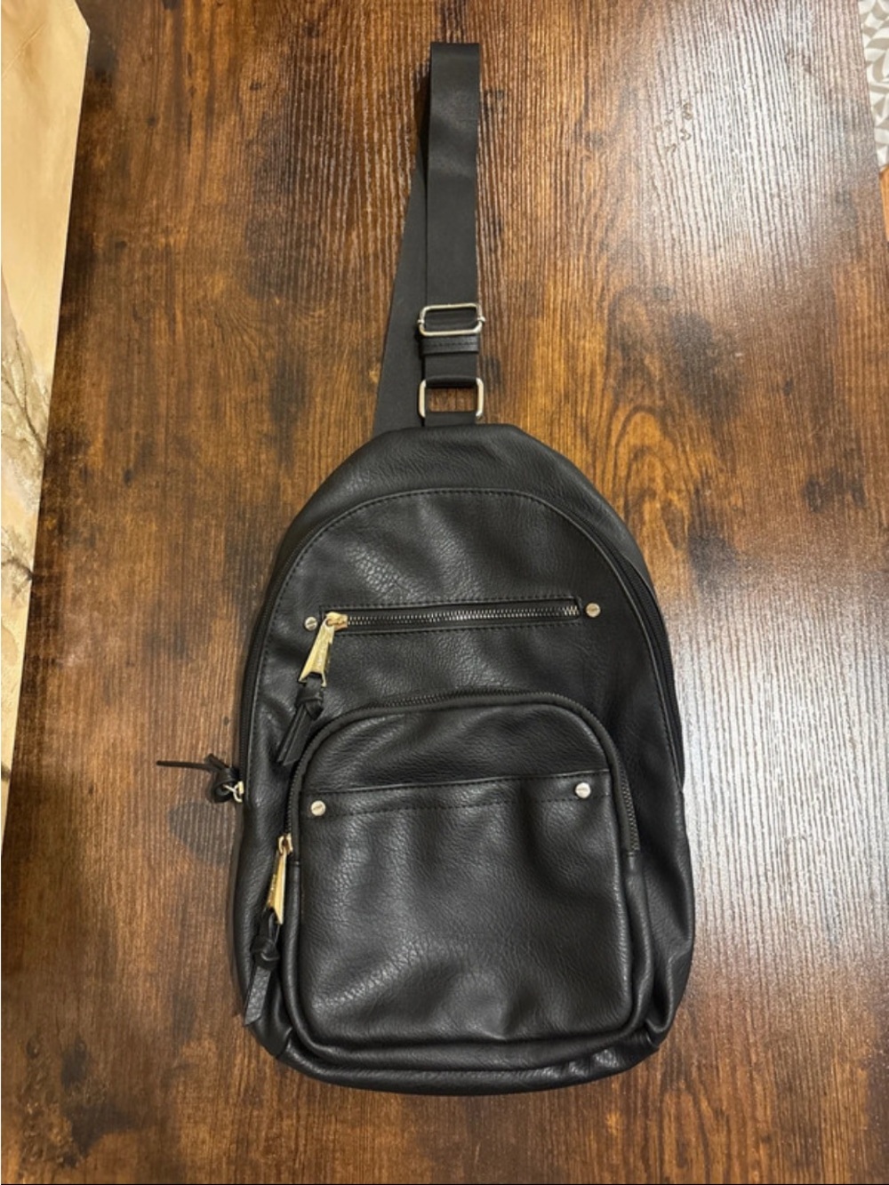 Dolce Vita Black Leather Sling Backpack with Gold Hardware